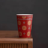 Red glaze floral medallion ceramic tea cup