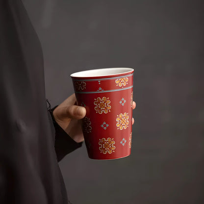 Floral Medallion Red Glaze Cup in hand